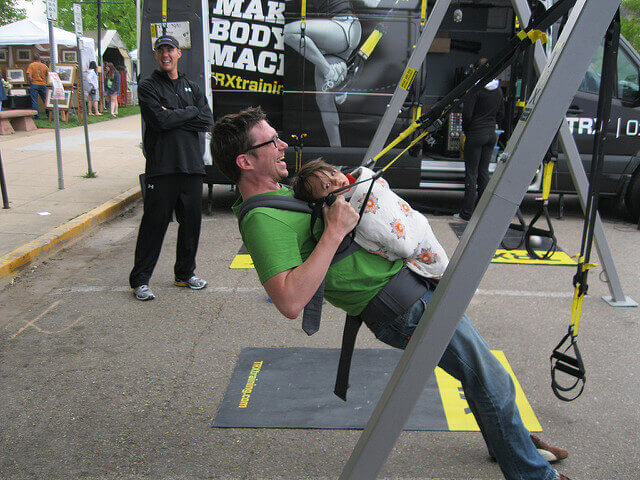 Suspension trainer packed into a small carry bag next to the loose straps