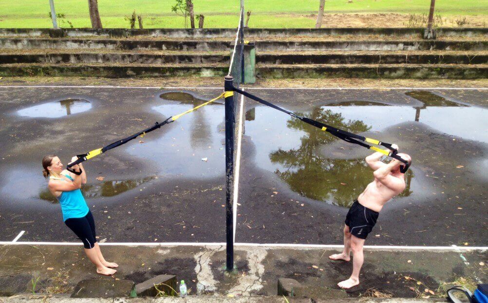 Suspension trainer straps anchored outdoors showing how flexible TRX mounting options are