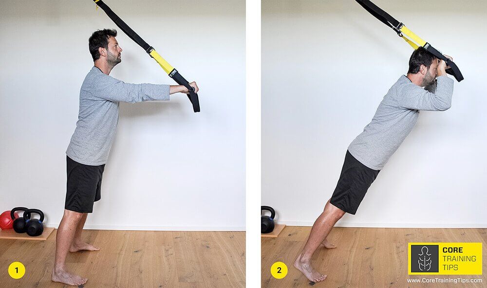 TRX Triceps Press lowering the forehead toward the handles with the elbows fixed